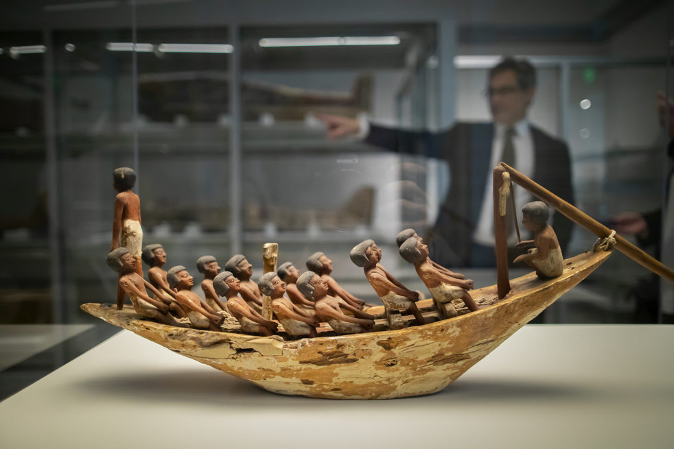 A new Penn Museum exhibition showcases 200 artifacts from its vast Egyptian collection, as well as their conservation, including a 4,000-year-old model of a rowing boat featuring 16 figures.