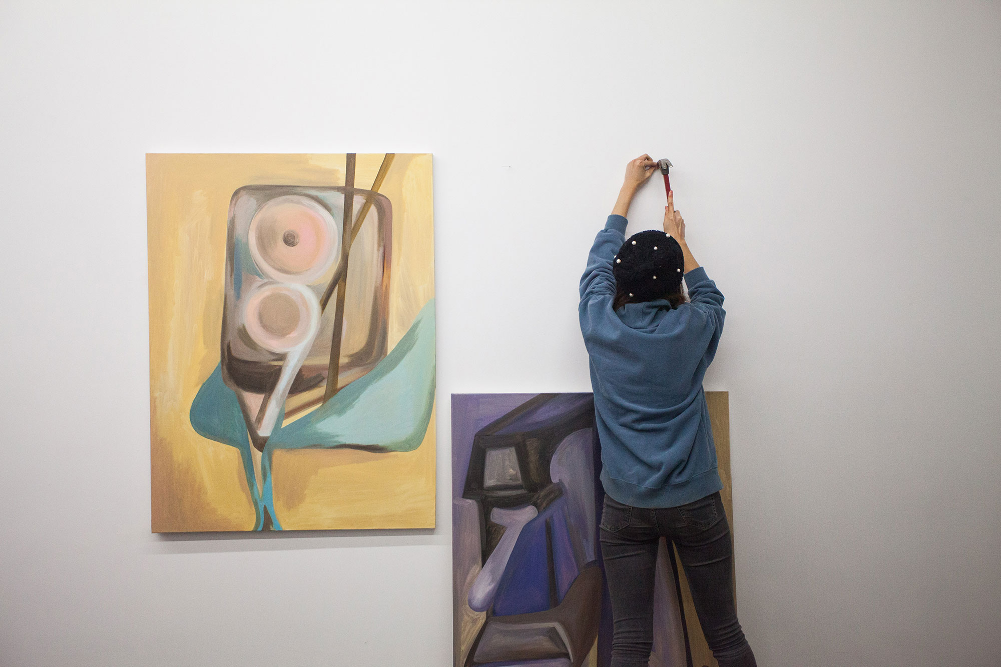 MFA student Xiaoxuan Liu installing work for “Close to Home,” the eleventh exhibition in the Incubation Series: a student-led initiative that fosters new ways of making, exhibiting, and seeing art. “Close to Home” was exhibited at High Tide gallery in fall 2018.