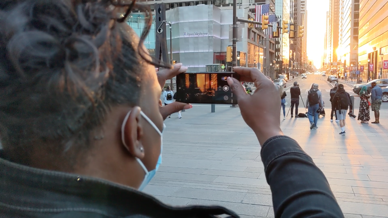 Participant using cell phone to create their film.
