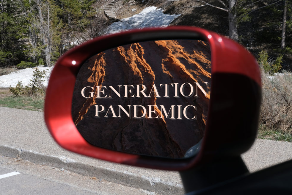 An image of a side-view car mirror that is reflecting a mountainous landscape, with the text "Generation Pandemic" centered in the frame.