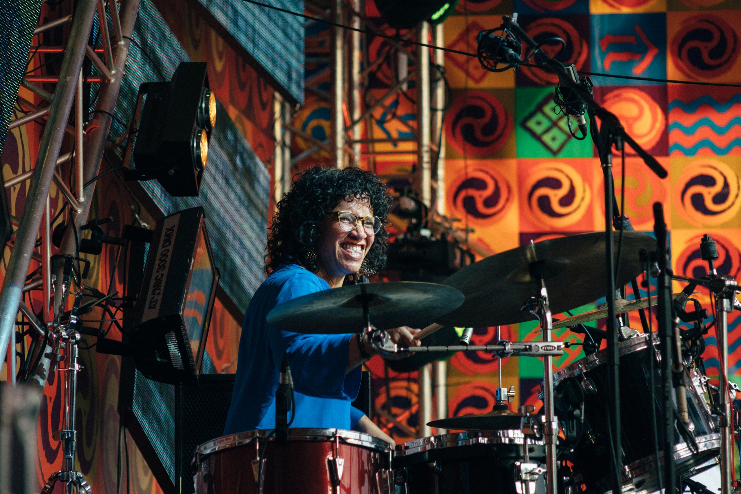 Artist LaFrae Sci playing the drums.