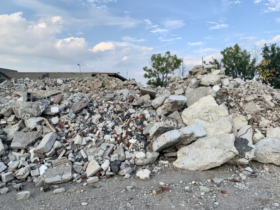 An image of construction rubble against a blue sky.