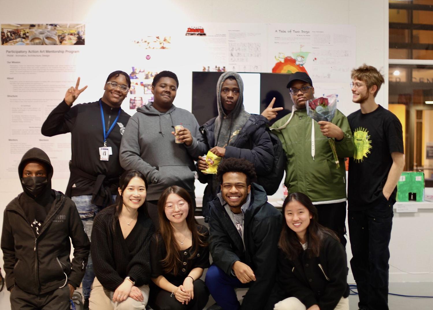 Group of students (high school and college) posing for the camera.
