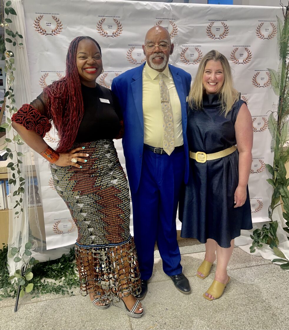 Tia Jackson-Truitt (Chief Diversity Officer), Rev. Malcolm Byrd (CEO and Founder of Forum Philly), and Jennifer Brehm (Director of Learning and Public Engagement) standing next to one another with their arms around each other posed for the picture.