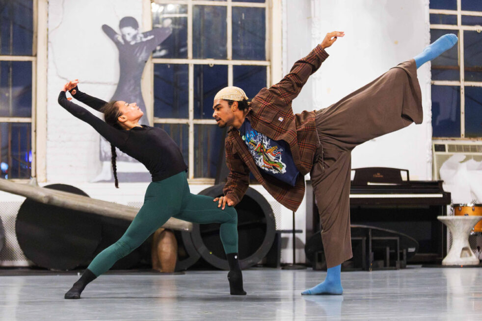 Two dancers rehearsing in a studio together