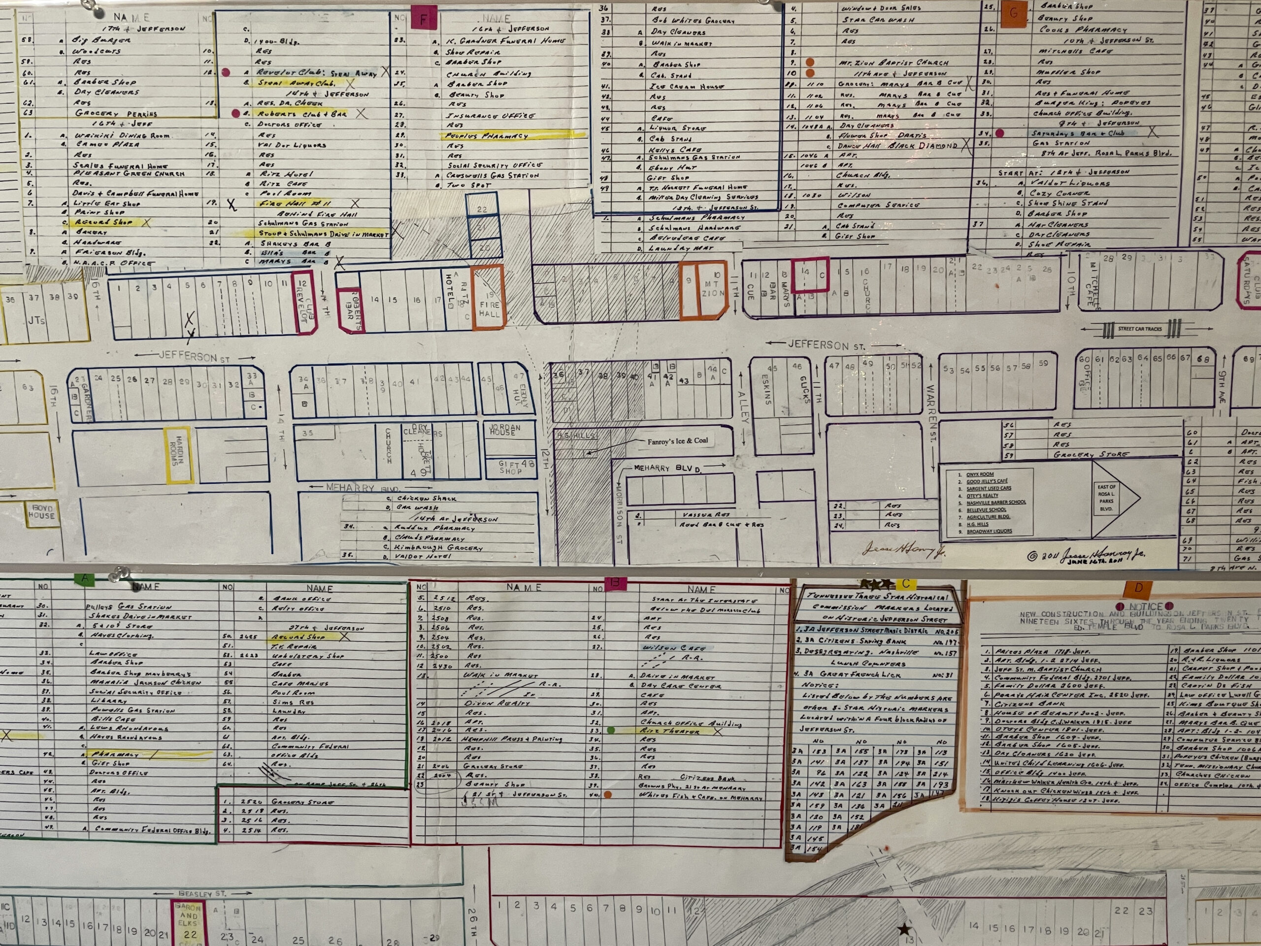 A detailed historical city block map with handwritten annotations and color-coded sections.